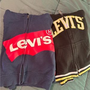 Pair of Levi’s hoodies with zippers.